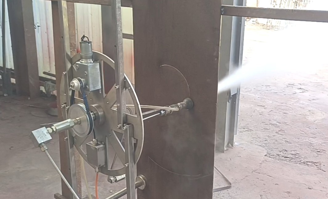 portable waterjet cuts on a pipe