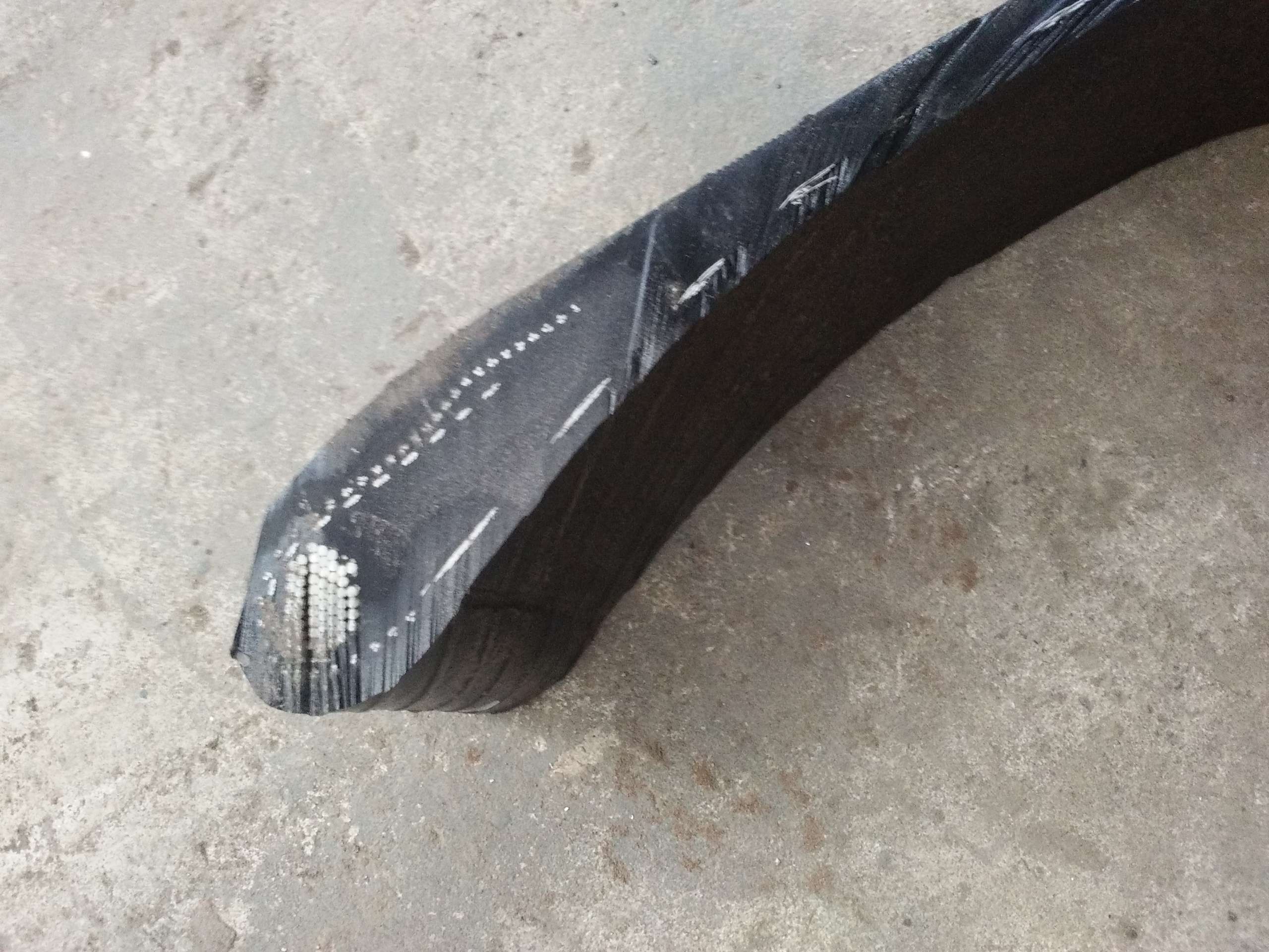 waterjet cuts a strip of tire